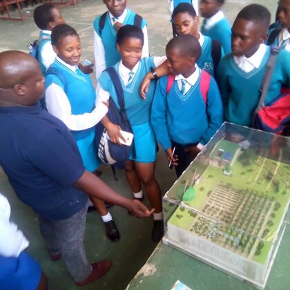 Learners engaging with SANEDI's environmental awareness exhibit during Astronomy and Space