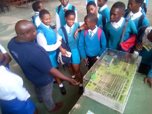 Learners engaging with SANEDI's environmental awareness exhibit during Astronomy and Space